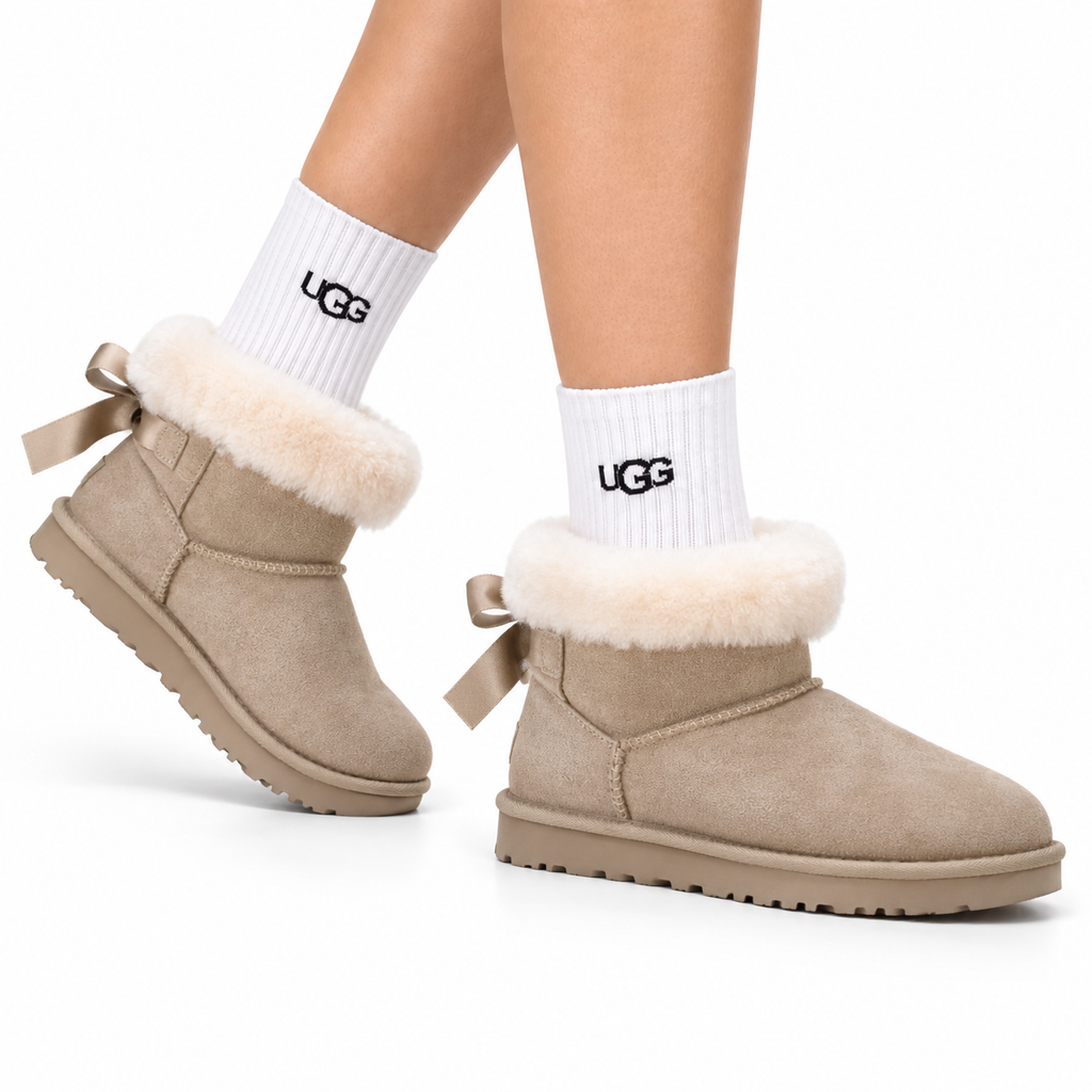 UGG Classic Ultra Mini Bow Ankle Boots - side-angle hero image